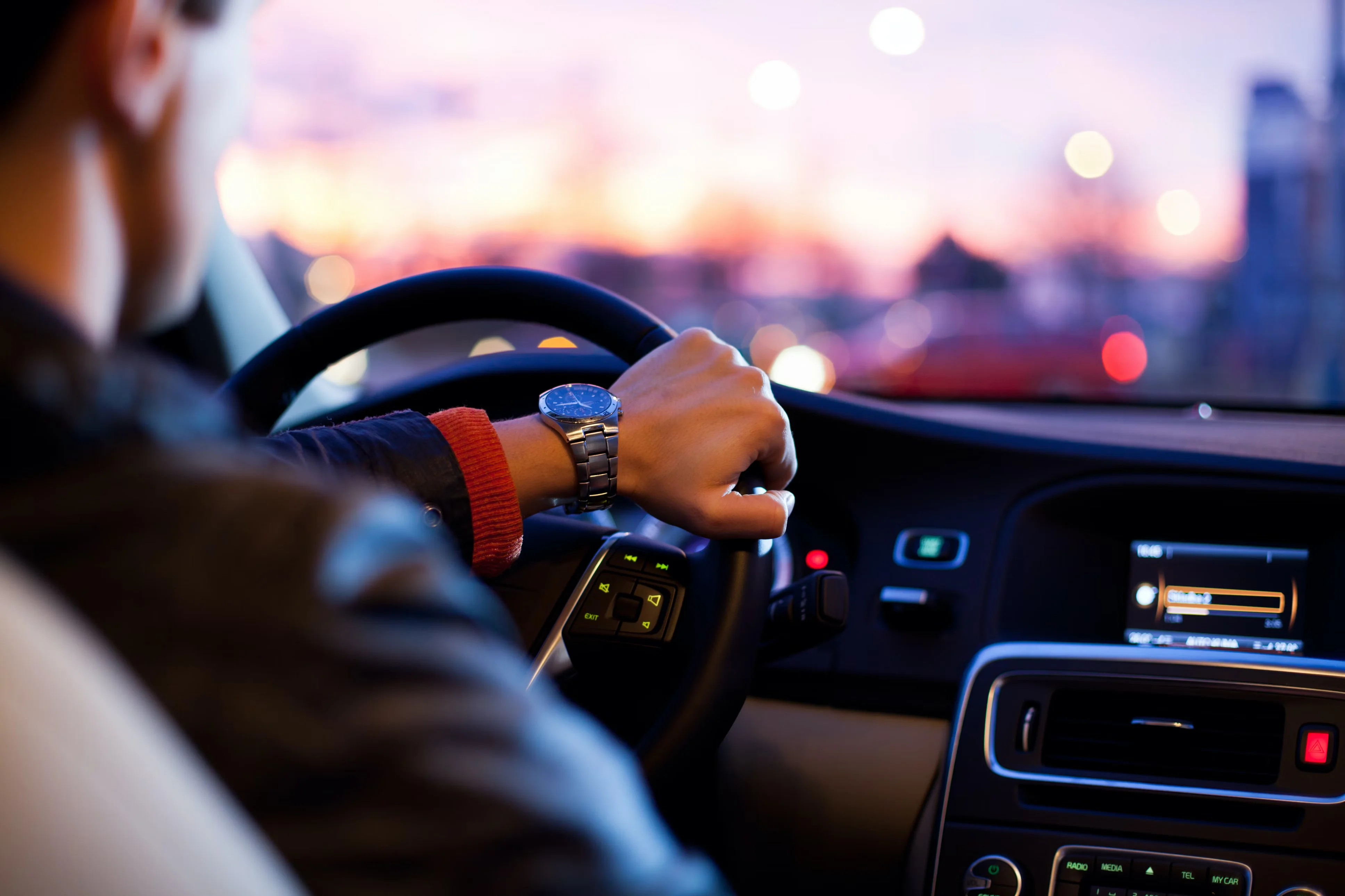 Professional chauffeur driving luxury vehicle for Portland airport transportation